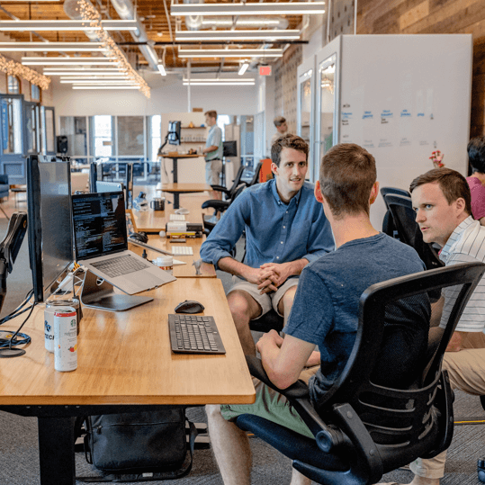 group of techs around table